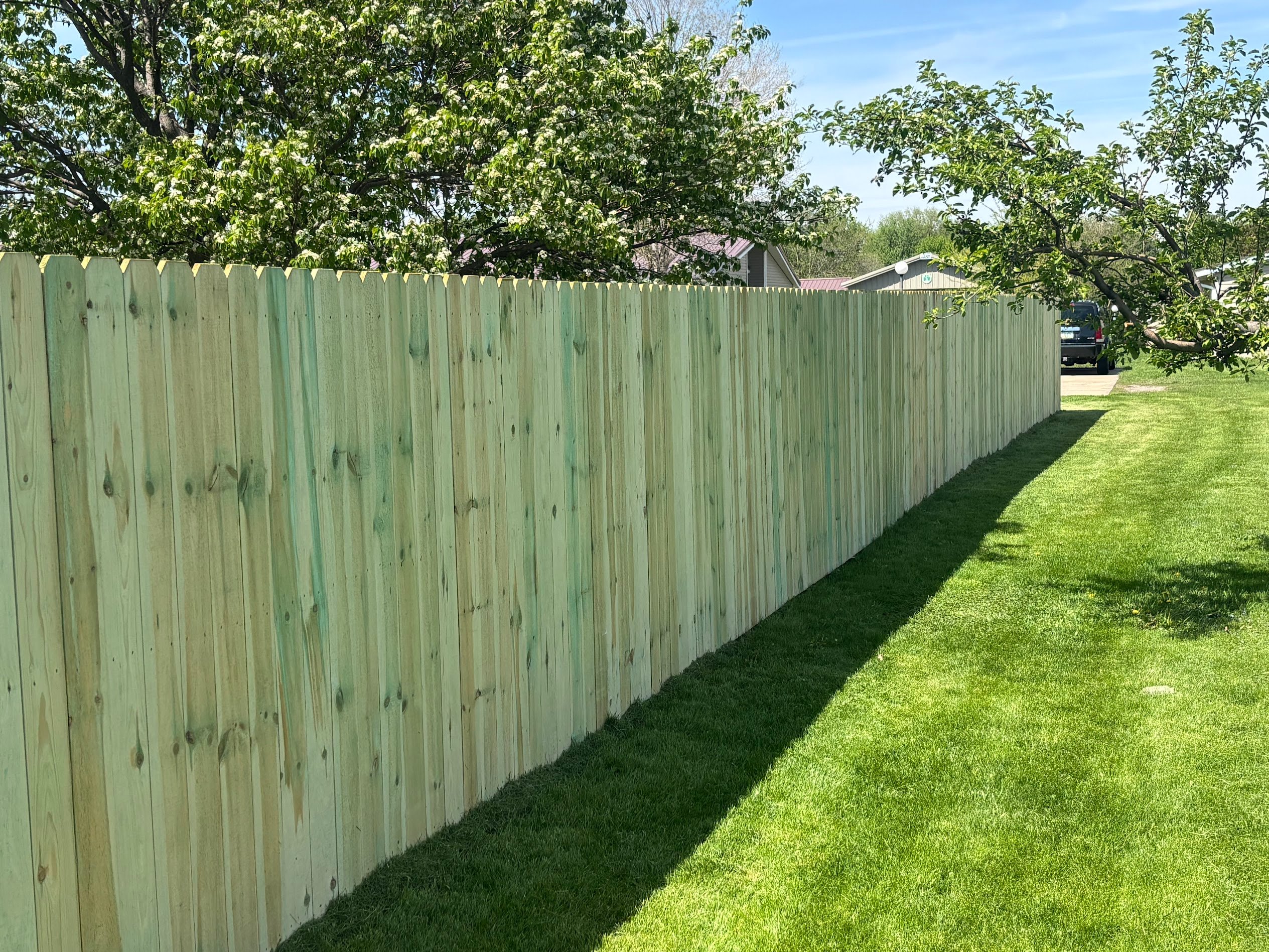 Wood privacy fence installation
