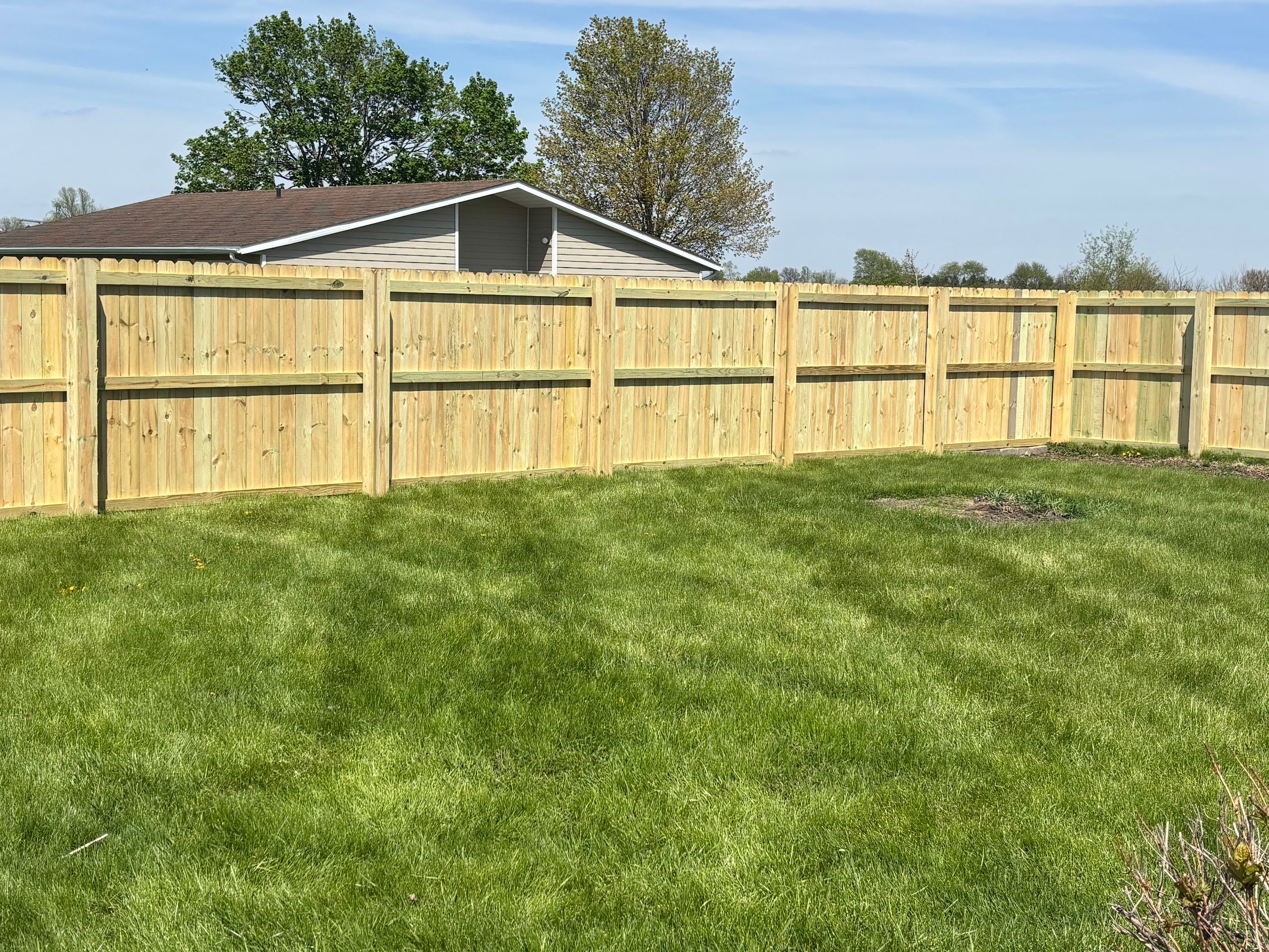 Wood privacy fence installation by Winslow Contracting